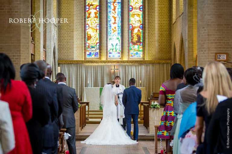 Bride and groom during wedding ceremony at St John the Divine church in South Croydon Surrey