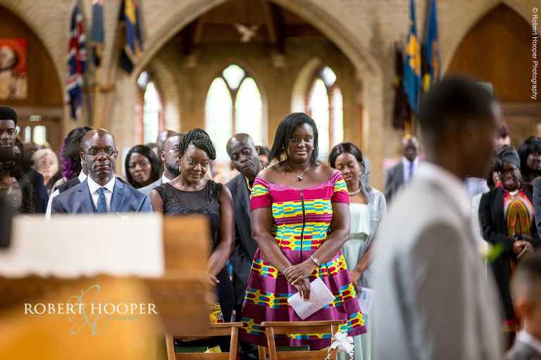 Wedding guests watching wedding service at St John the Divine Church South Croydon Surrey