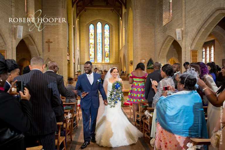 Bride and groom walk back up the isle as husband and wife at St John the Divine Church South Croydon Surrey