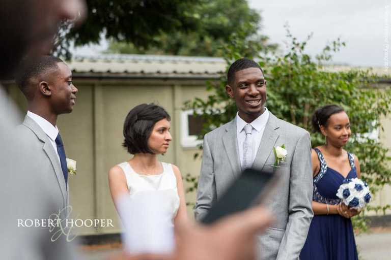 Wedding guests outside St John the Divine Church on wedding day South Croydon Surrey