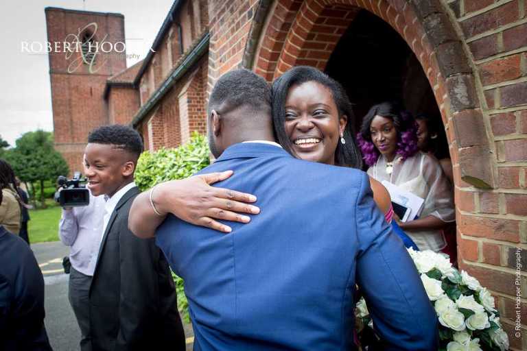 Friends congratulating couple on getting married at St John the Divine Church South Croydon Surrey
