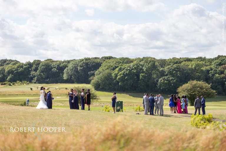 Wedding guests enjoying the sunshine and view at Farleigh Golf Club Warlingham Surrey