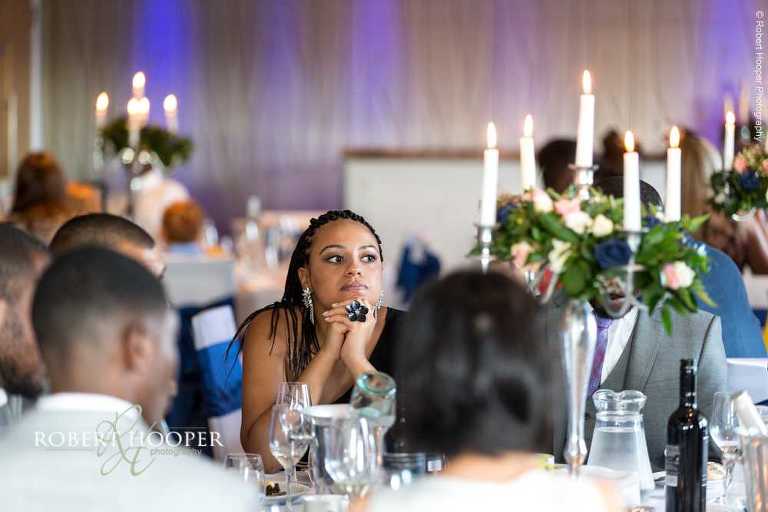 Wedding guests seated for wedding breakfast on wedding day at Farleigh Golf Club Warlingham Surrey