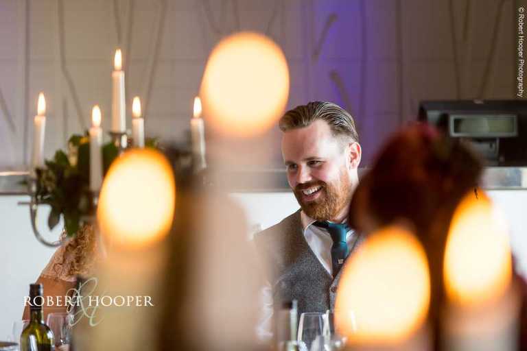 Wedding guests seated for wedding breakfast on wedding day at Farleigh Golf Club Warlingham Surrey