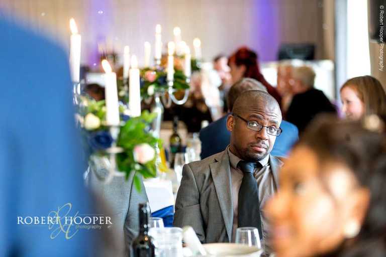 Wedding guests seated for wedding breakfast on wedding day at Farleigh Golf Club Warlingham Surrey