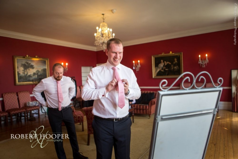 Groom preps for wedding at Addington Palace