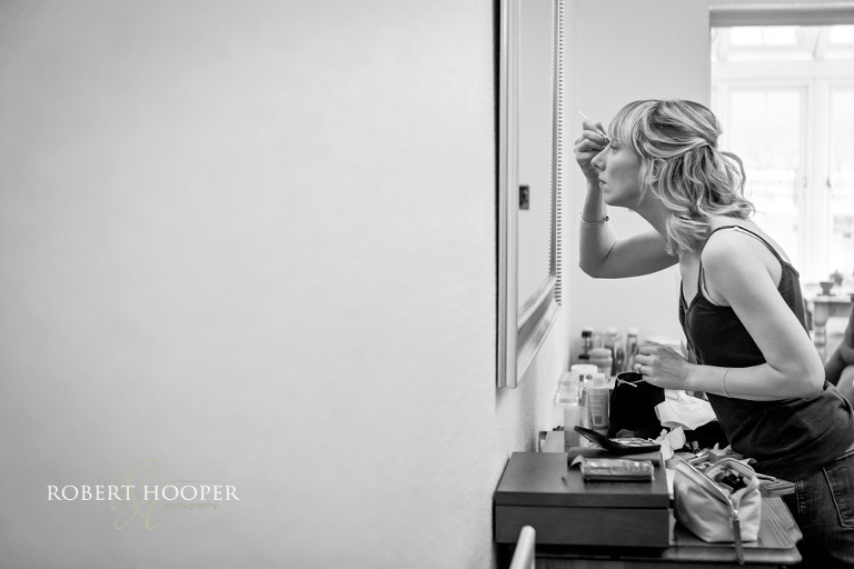 Bridesmaid getting ready for wedding day at Denbies
