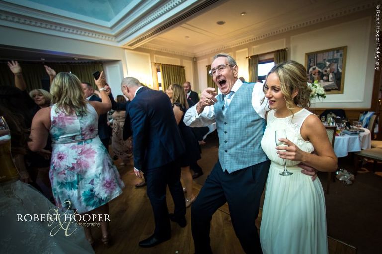 wedding guests dancing at reception