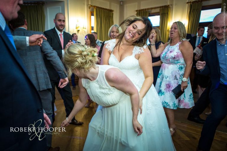 bride dancing with bridesmaid at London Golf Club wedding