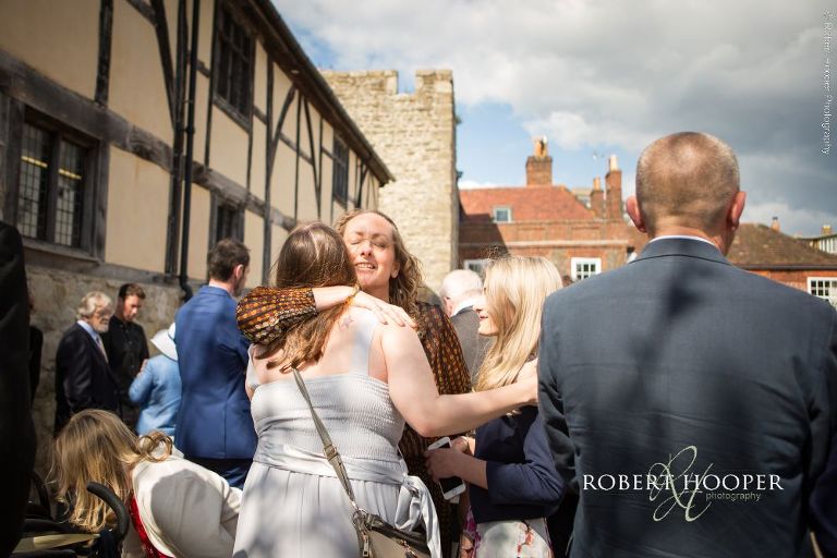 wedding guests greeting eachother