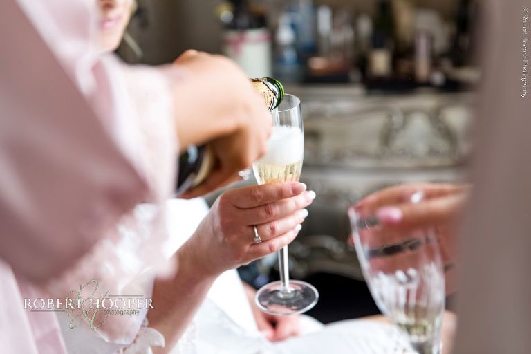 glass of champagne being poured