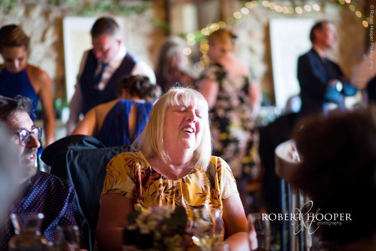 wedding guest laughing