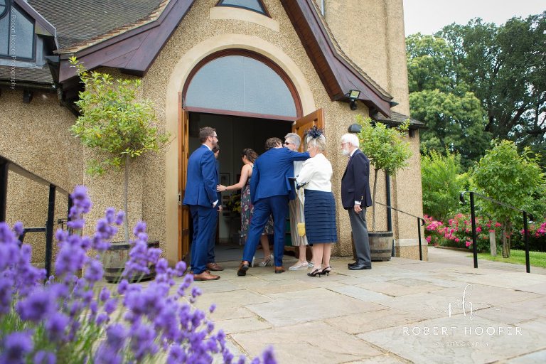wedding guests arriving at church
