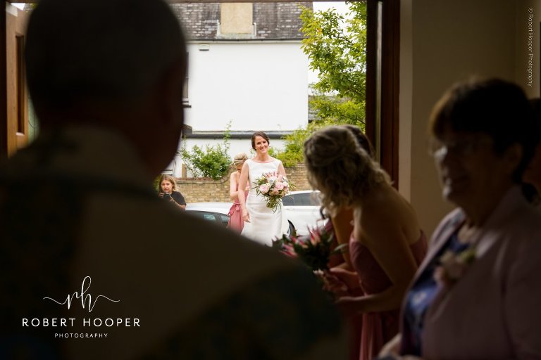 bride entering church for wedding