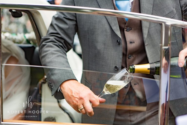 chaffeur pours champagne
